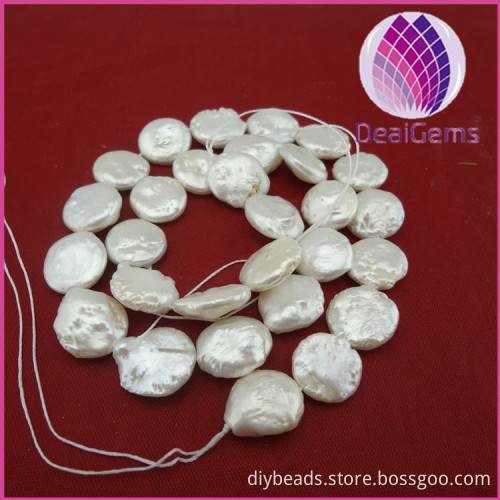 Pearl,Baroque, cultured freshwater ,white, 12-13mm flat round, Mohs hardness 2-1/2 to 4. Sold per pkg of (10) 16-inch strands